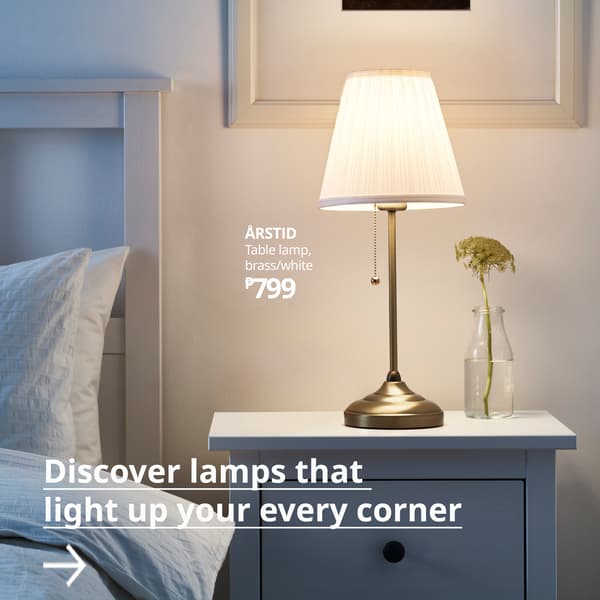 A brass/white ÅRSTID table lamp