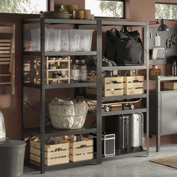 A BROR heavy-duty shelving combination in black with wooden and plastic storage boxes in a cellar