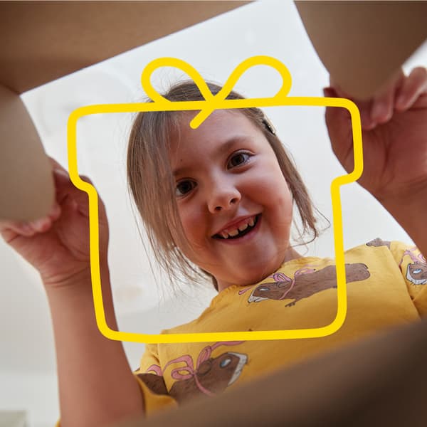 A child looks into a box.