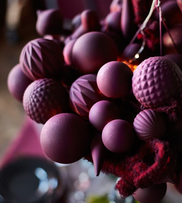 A close-up image of a centrepiece hanging above a dining table.
