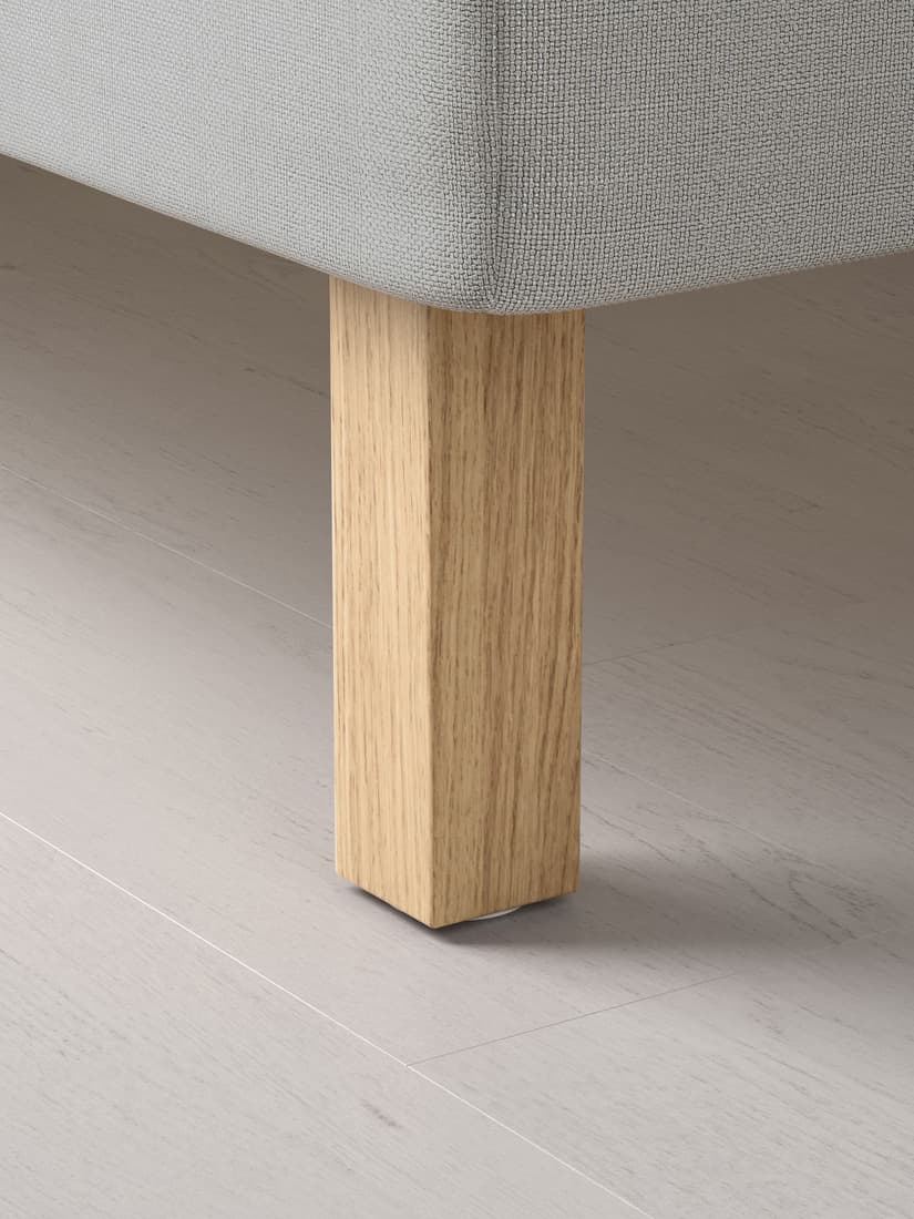 a close up of a bed leg that is attached to a bed base