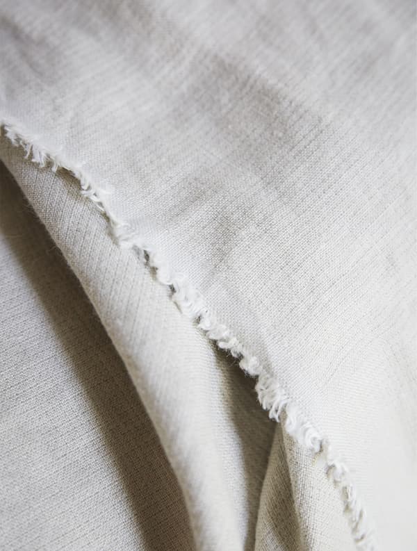 A close-up of a beige throw.