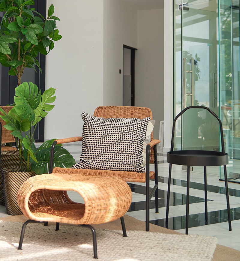 A close-up of a chair and a side table.