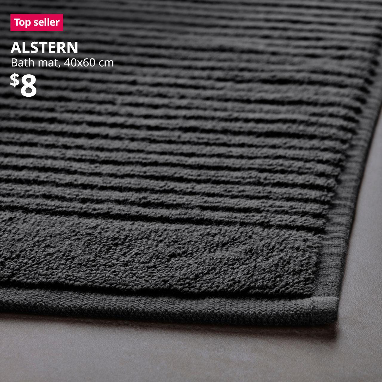 A close-up of a dark grey ALSTERN bath mat to show the material and product quality. A red "Top seller" label is on the top left of image, with black text below that reads: ALSTERN, Bath mat, 40x60 cm, Price at $8.