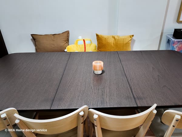 A close-up of a STRANDTORP extendable dining table, for a refreshed 3-room HDB flat in Singapore, designed by IKEA home design service
