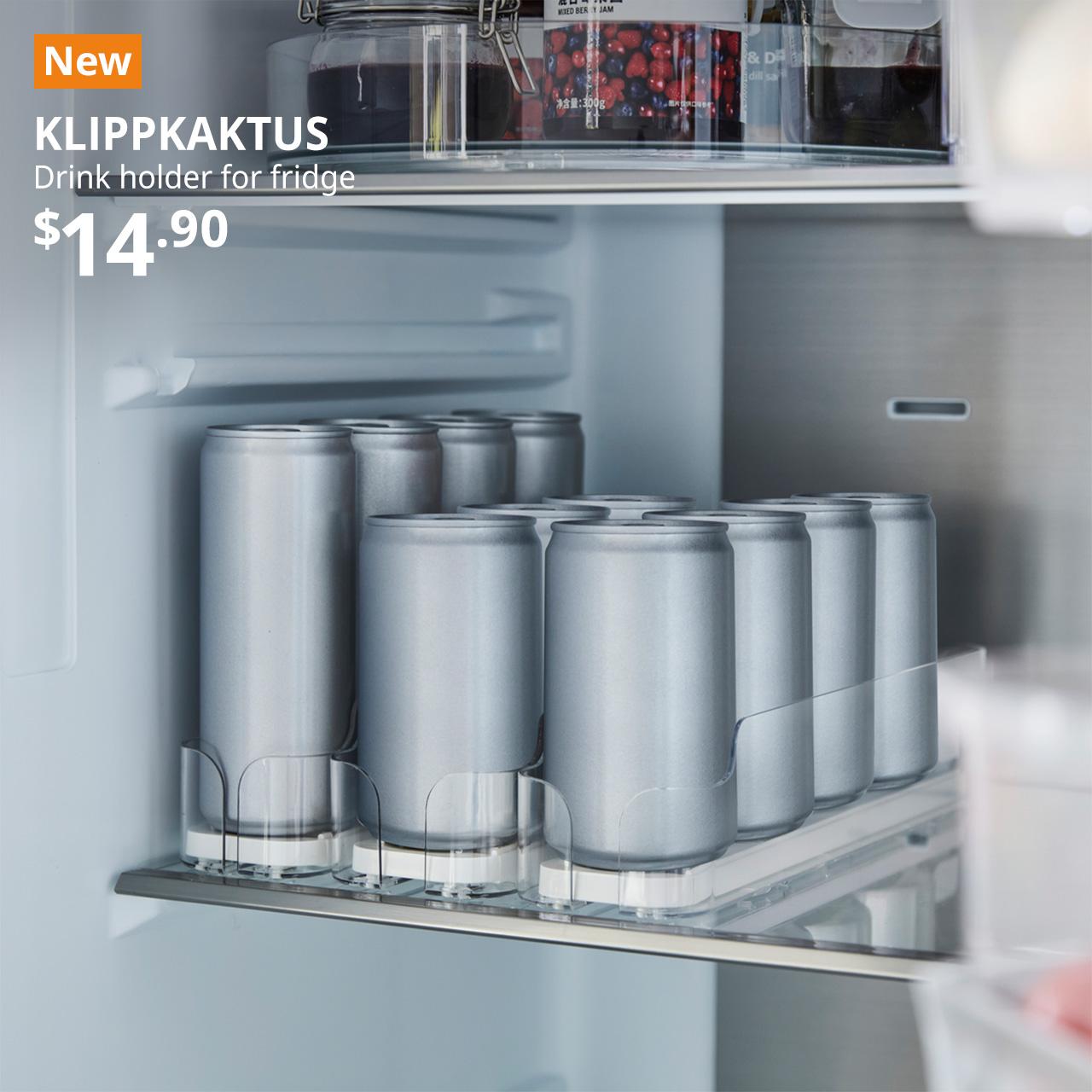 A close-up of an opened fridge with 3 rows of transparent KLIPPKAKTUS drink holder for fridge with canned drinks. An orange "NEW" label is on the top left of the image with white text that reads: KLIPPKAKTUS, Drink holder for fridge, $14.90. 