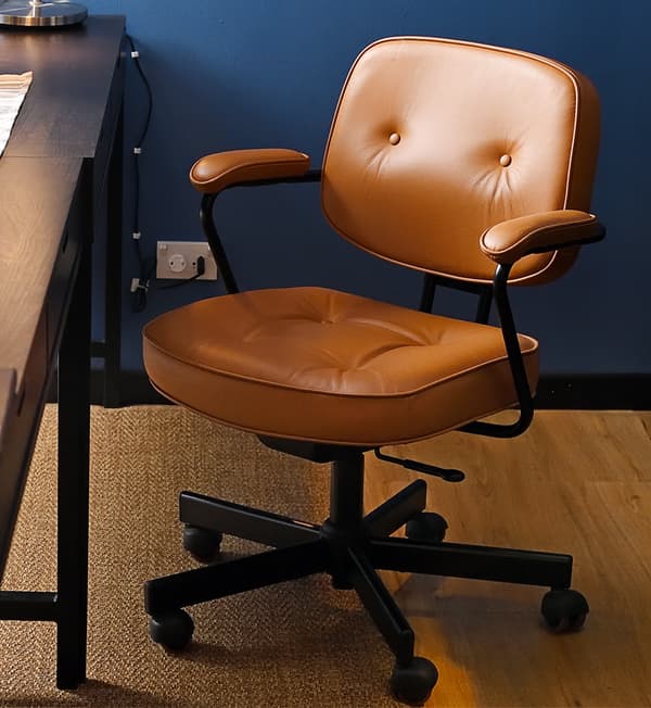 A close-up of an orange swivel chair.