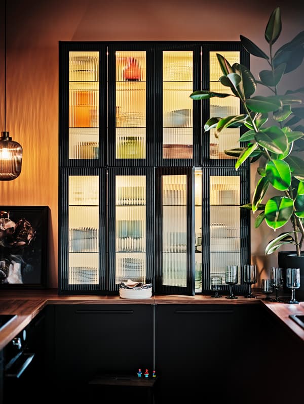 A close up of kitchen wall cabinets with HEJSTA accent door fronts.