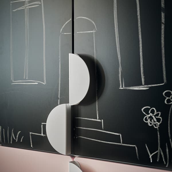 A close-up of the blackboard front of SMÅSTAD wardrobe, including separate half-circle shaped handles for customising with.