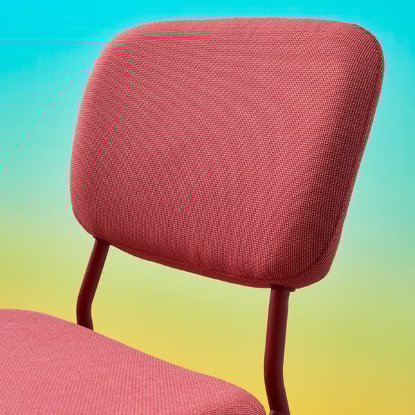 A close-up on the upholstered backrest and seat of KARLJAN chair with a metal frame.