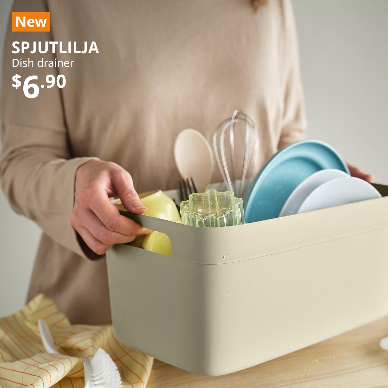 A close-up shot of a lady carrying a light grey-beige SPJUTLILJA dish drainer. On the top left corner, a orange tag with white text that reads 'New', followed by white text overlay image that reads 'SPJUTLILJA, Dish drainer, $6.90'
