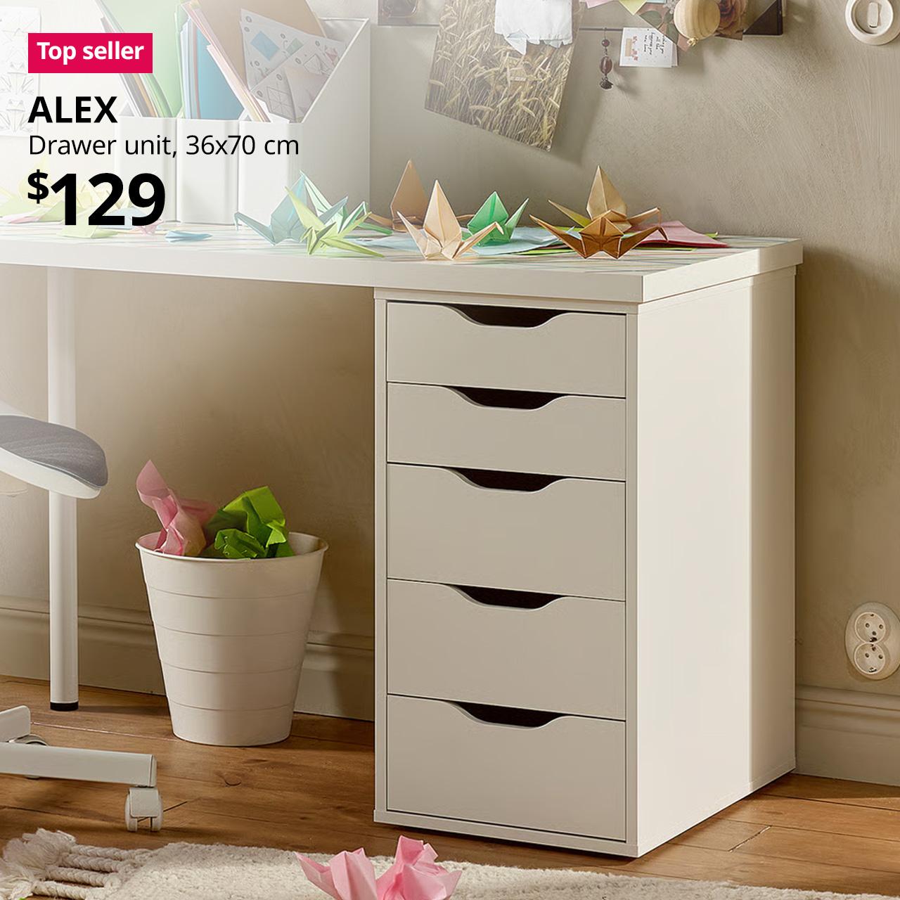 A close-up shot of a white ALEX drawer unit with a white LINNMON table top placed on it bo build a desk. On the top left corner, a red/pink tag with white text that reads 'Top seller', followed by black text overlay image that reads 'ALEX, Drawer unit, 36x70 cm, $129'.