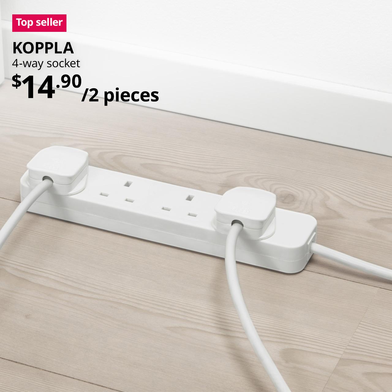 A close-up shot of a white KOPPLA 4-way extension socket on the vinyl flooring. On the top left, a red/pink tag with white text that reads "Top seller", followed by black text overlay image that reads, "KOPPLA, 4-way socket, $14.90/2 pieces".
