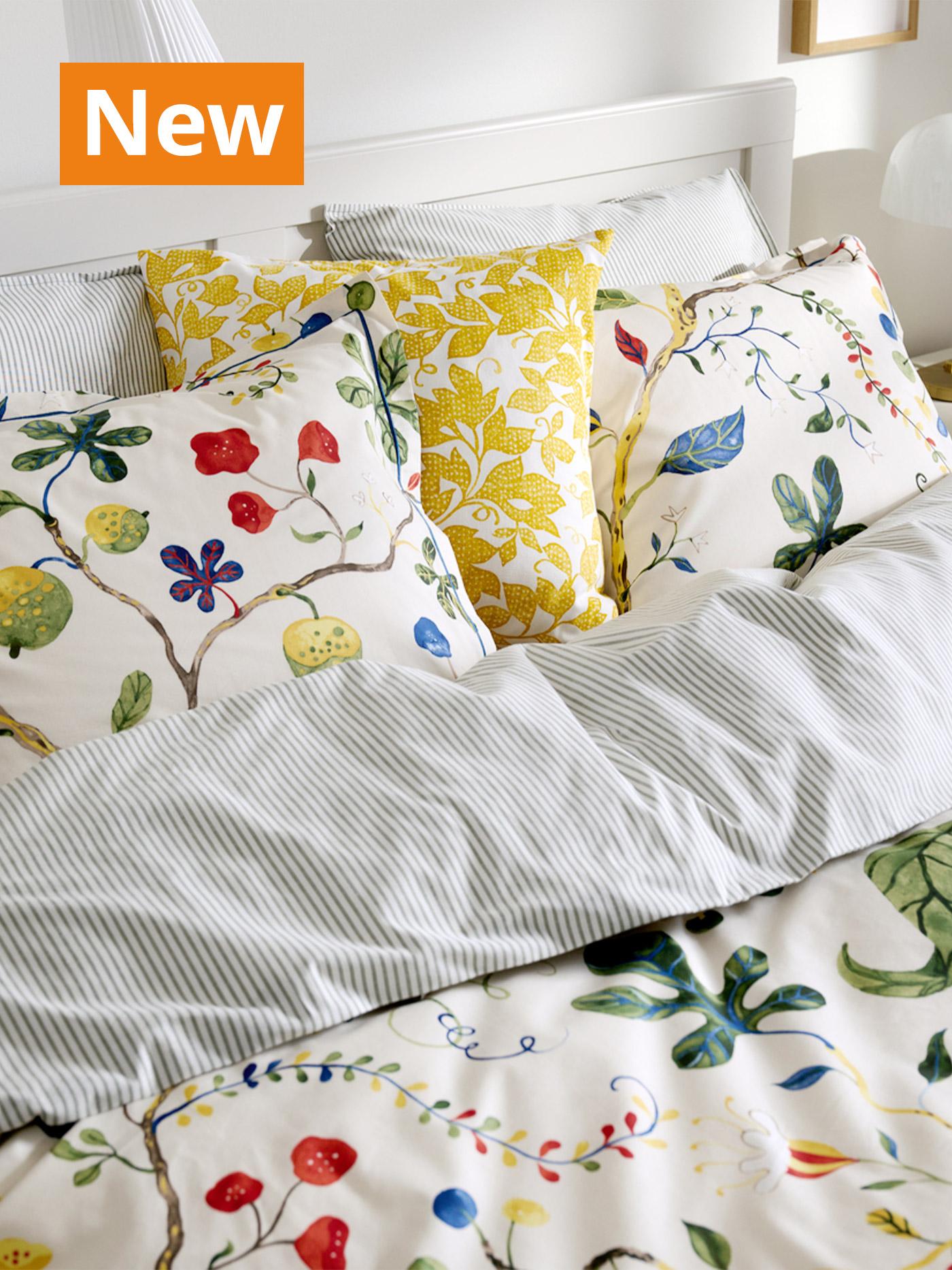 A close-up shot of light beige with floral patterns KRONBUSKE duvet set with pillowcases. Overlaying the image, orange tag that reads 'New' on the top left corner.