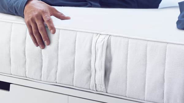 a close up shot of the side of a white mattress