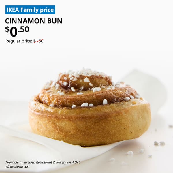 A close-up sideview of a cinnamon bun. Blue tag with white text that reads "IKEA Family price". Black text overlay image that reads "CINNAMON BUN, $0.50. Regular price: $1.50"