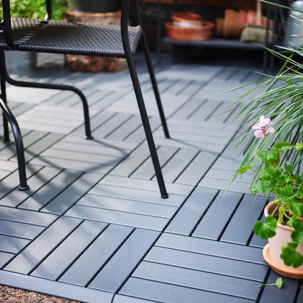 A close up view of the RUNNEN dark gray outdoor decking.