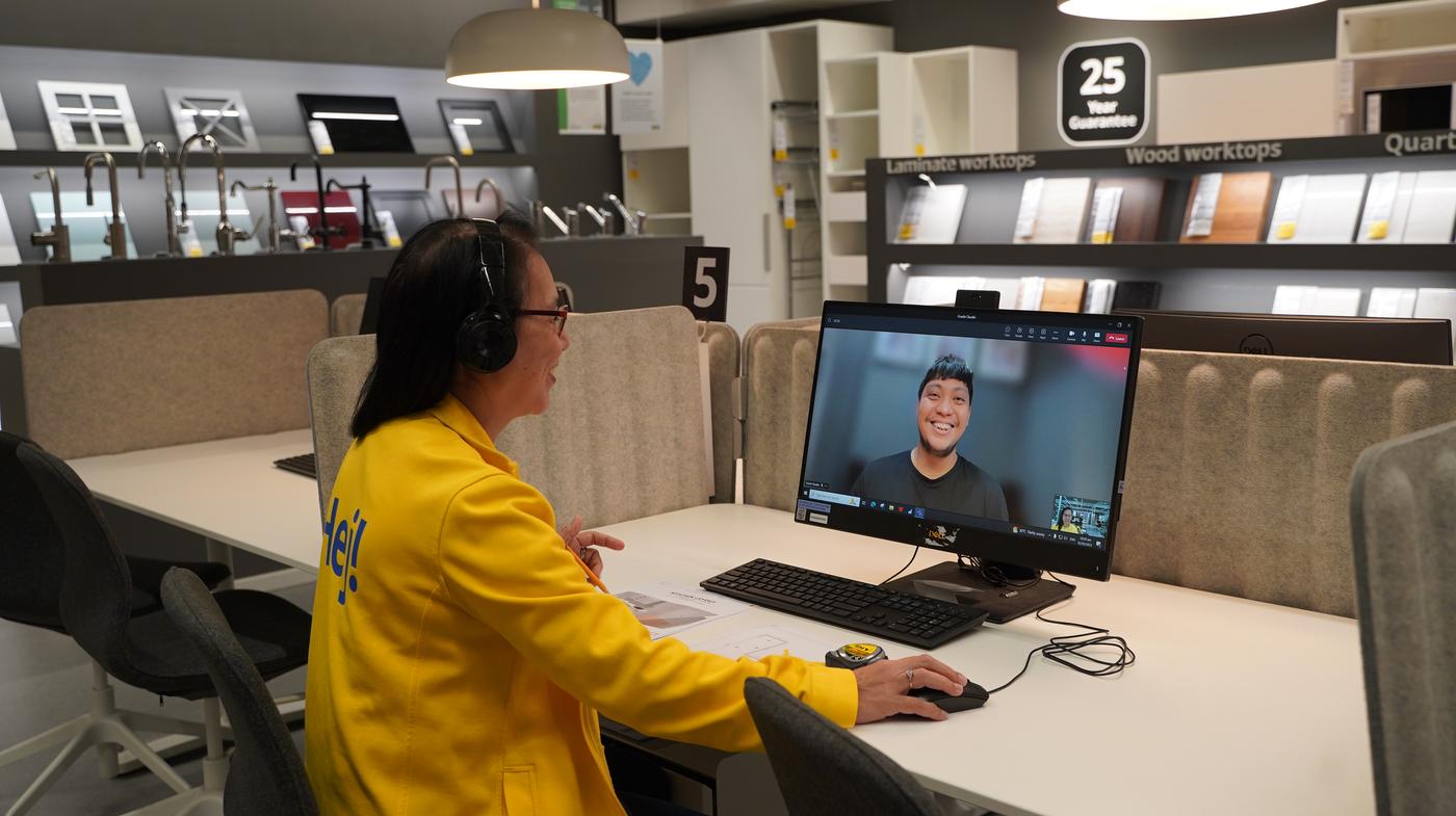 A co-worker is attending to a customer online.