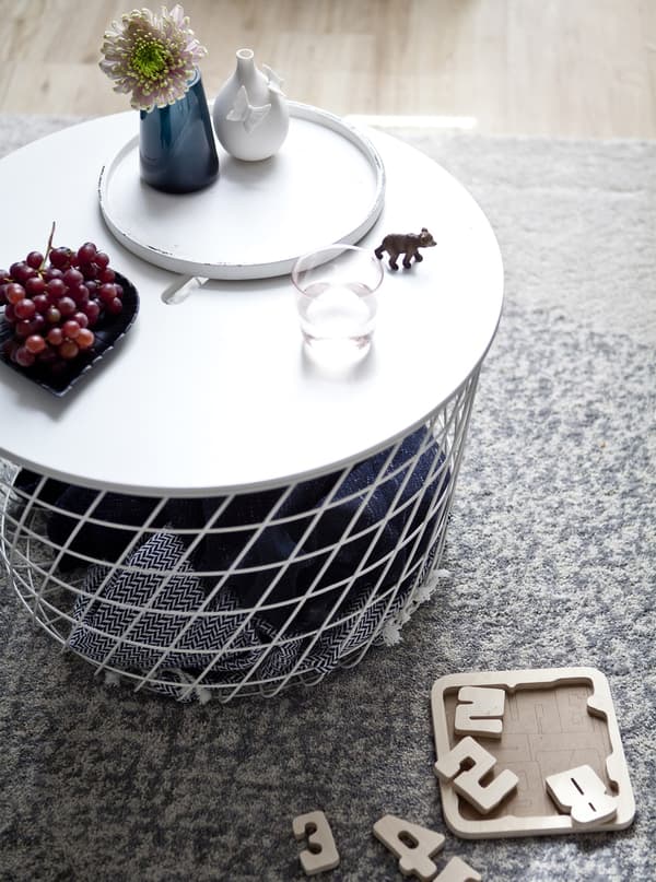 A coffee table with blankets stored inside.