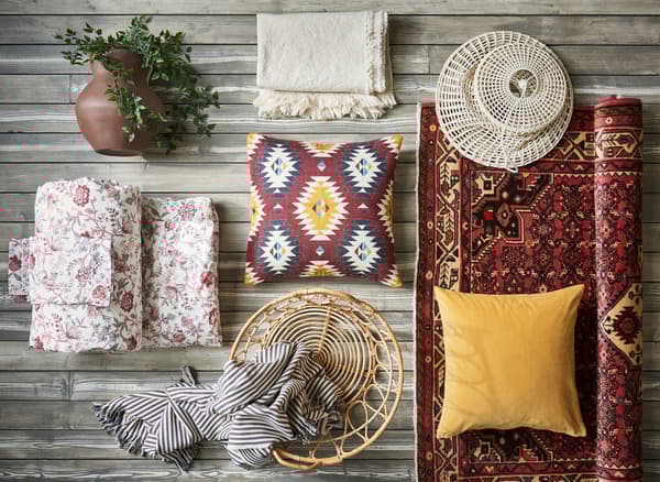 A collage of yellow and red textiles and decorative accessories.