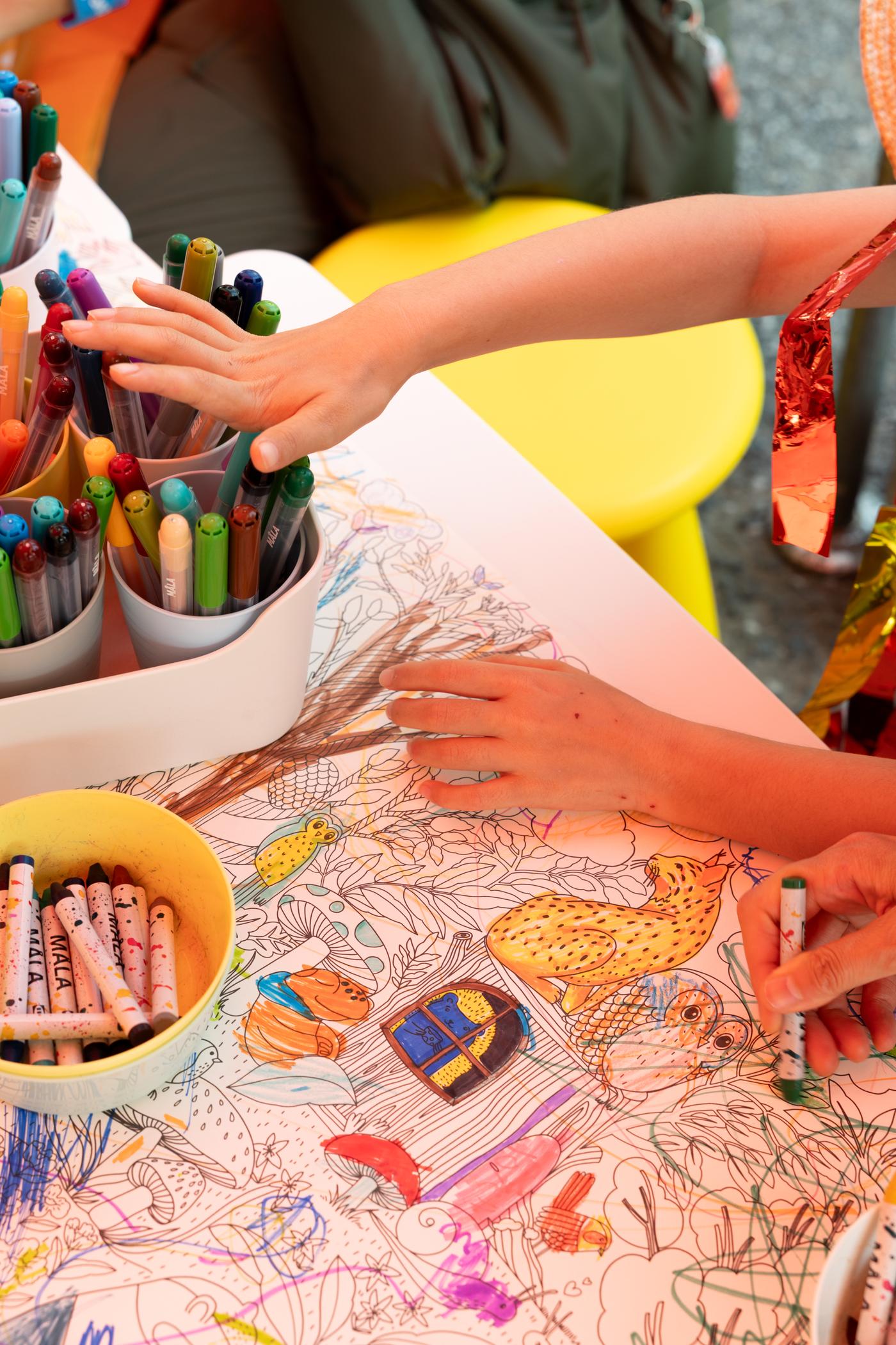 A colorful drawing in progress, being colored in like a coloring book. Next to it is a shape with many sides.