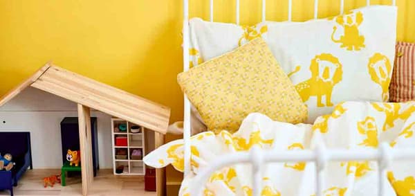 a-colourful-kids-room-with-yellow-walls-and-ikea-djungelskog-lion-print-bedding
