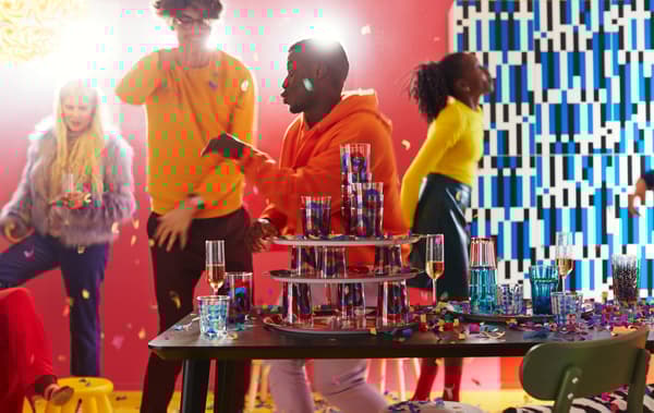 A colourful party with different kinds of glasses, like FRAMKALLA glasses with a curvy, bold pattern in red and blue.