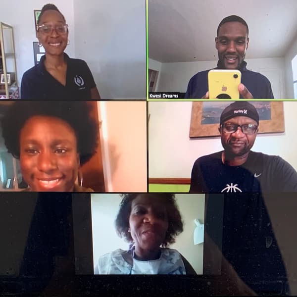 A computer screen is showing five people on a video conference call.
