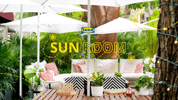 A couch with umbrellas around it