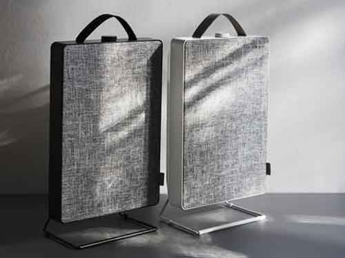A couple of FÖRNUFTIG air purifiers sitting side by side on a table