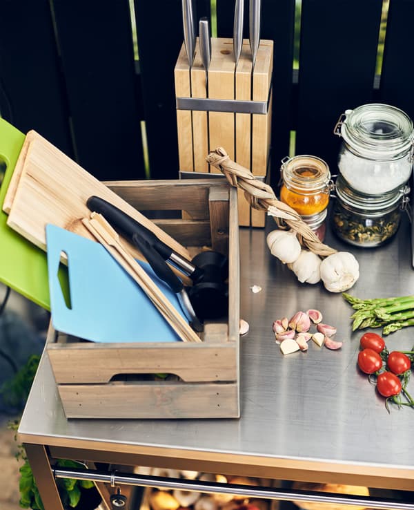 A crate containing kitchen utensils.