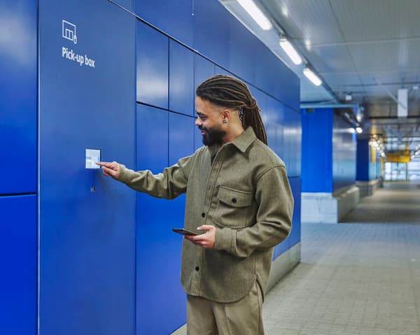 A customer collecting their order from a locker