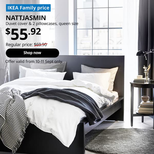 A dark bedroom with a dark brown MALM bedframe, which is covered with white NATTJASMIN duvet cover and pillows. Words on image read "IKEA Family Price, NATTJASMIN, Duvet cover & 2 pillowcases, queen size, $55.92, Regular price, $69.90 with a slash, shop now, Offer valid from 10-11 Sept only"
