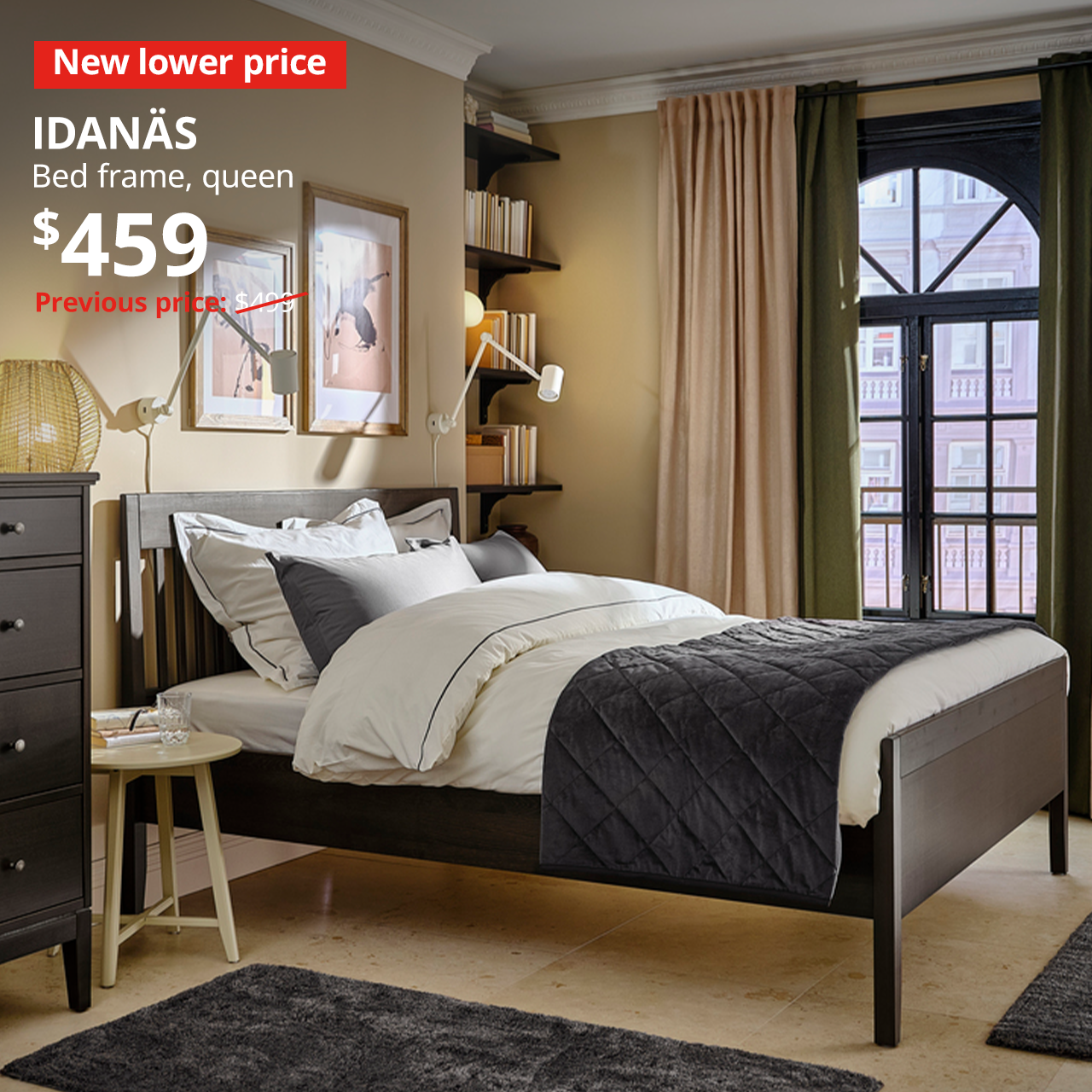A dark brown IDANAS bed frame in the middle of a bedroom, with white and grey covers and sheets. A red "New lower price" label is on the top left of the image with white text that reads: IDANAS, Bed frame, queen, Price at $459, Previous price, $499.