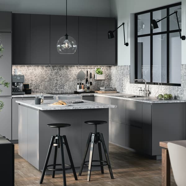 A dark grey VOXTORP kitchen with an island