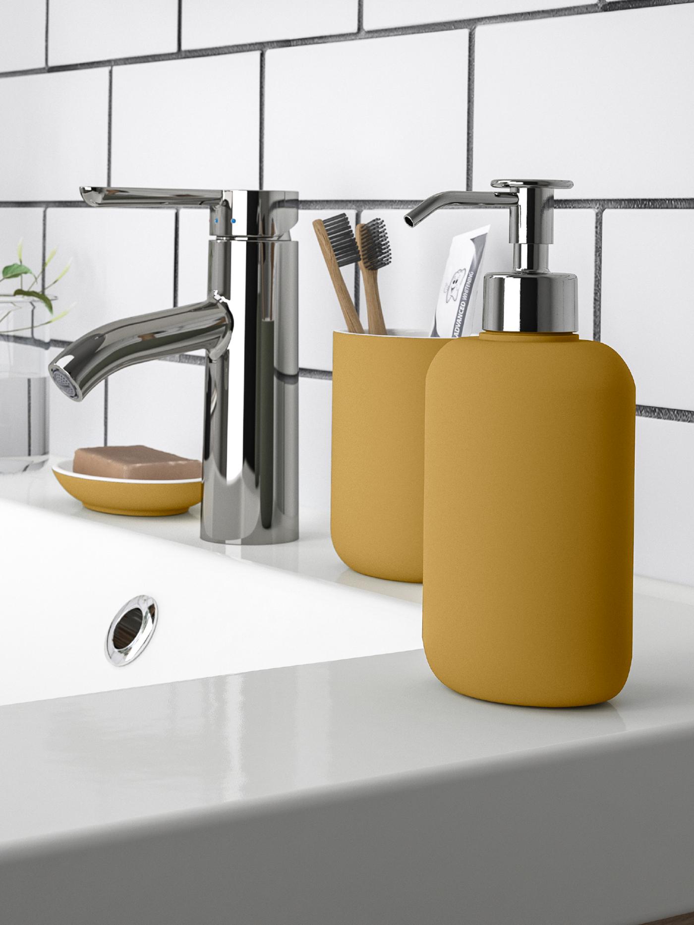 A dark yellow EKOLN soap dispenser