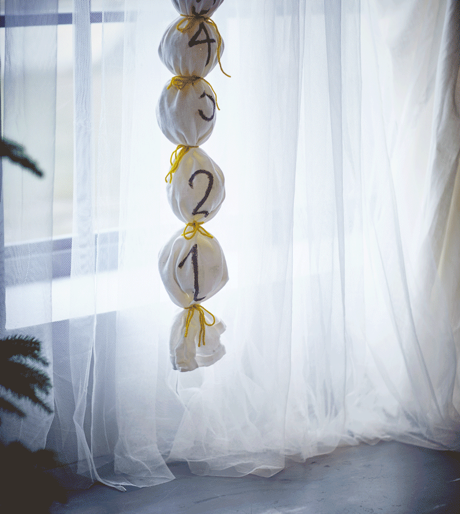 A decorative Advent calendar hangs from the ceiling.