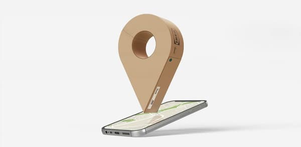A digital map pin drop hovering over a mobile device.