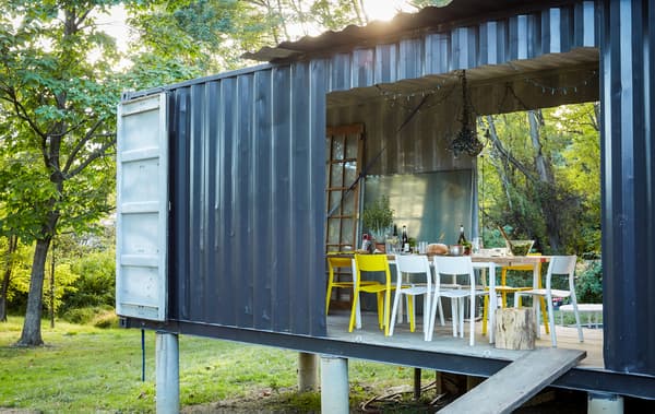 A dining room in a shipping container.