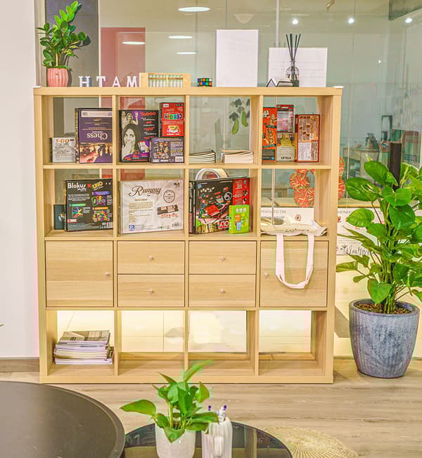 A display cabinet displaying books and other decorations.