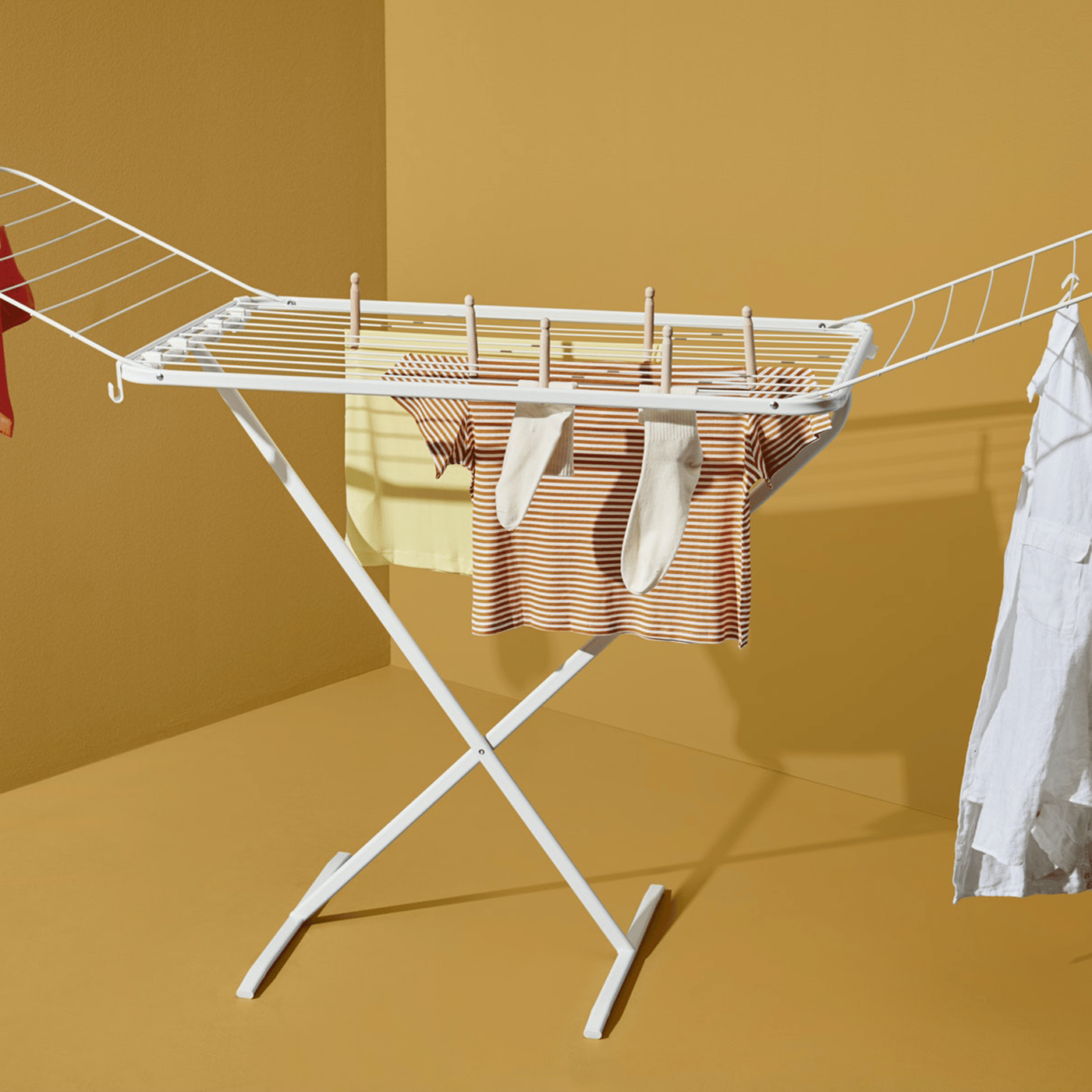  A drying rack on an ocher background.