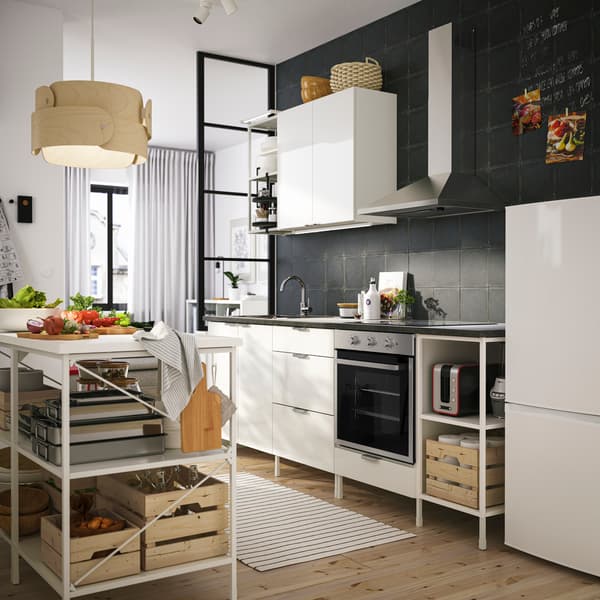 A ENHET high-gloss kitchen with black worktop in a bright modern room.