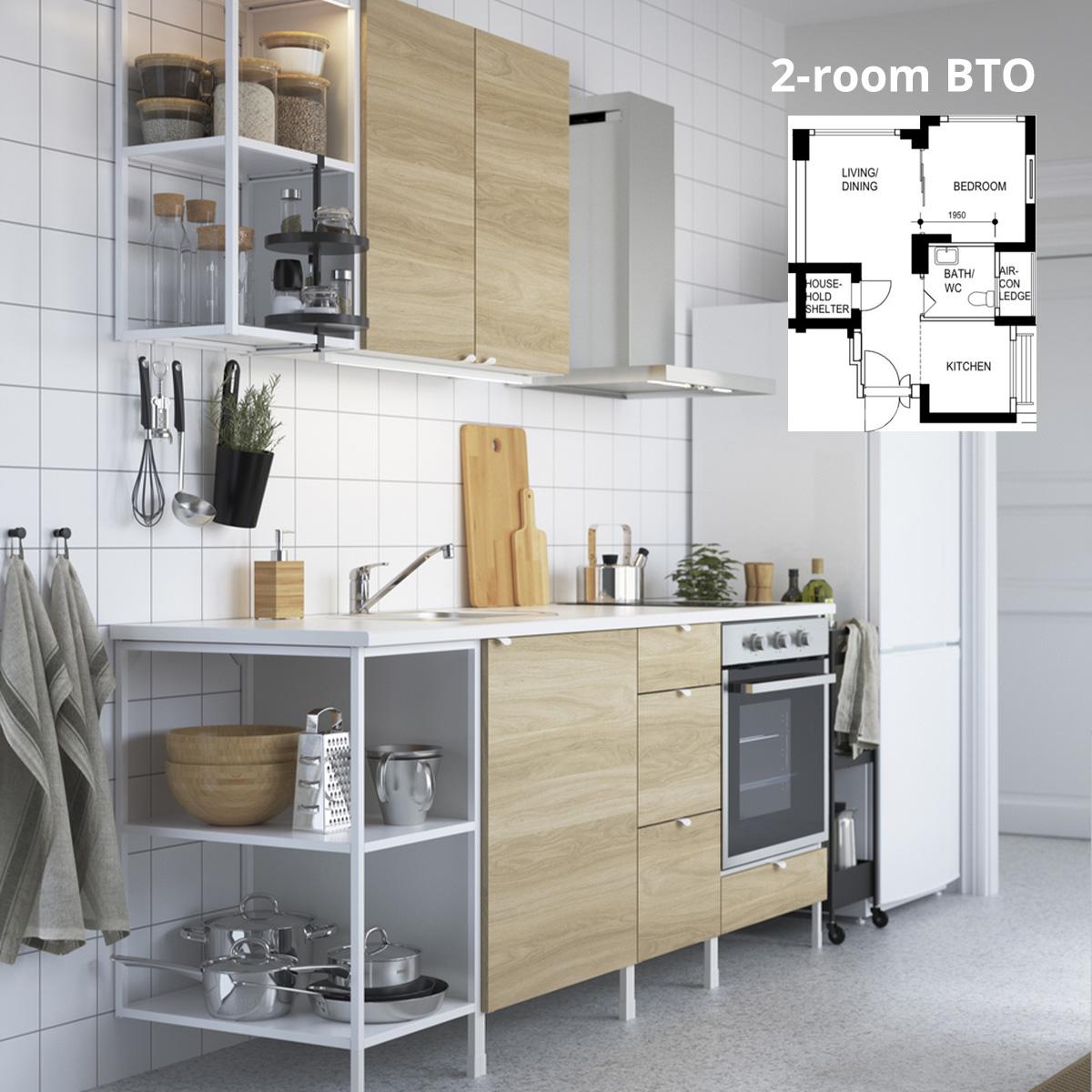 A ENHET kitchen with white frame, a oak effect door front and a white JÄRSTORP worktop in a kitchen setting. A 2-room BTO floor plan is featured on the top-right corner.