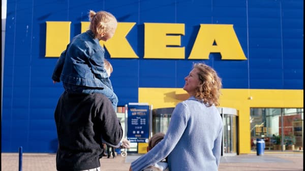 A family of 4 walking into an IKEA store