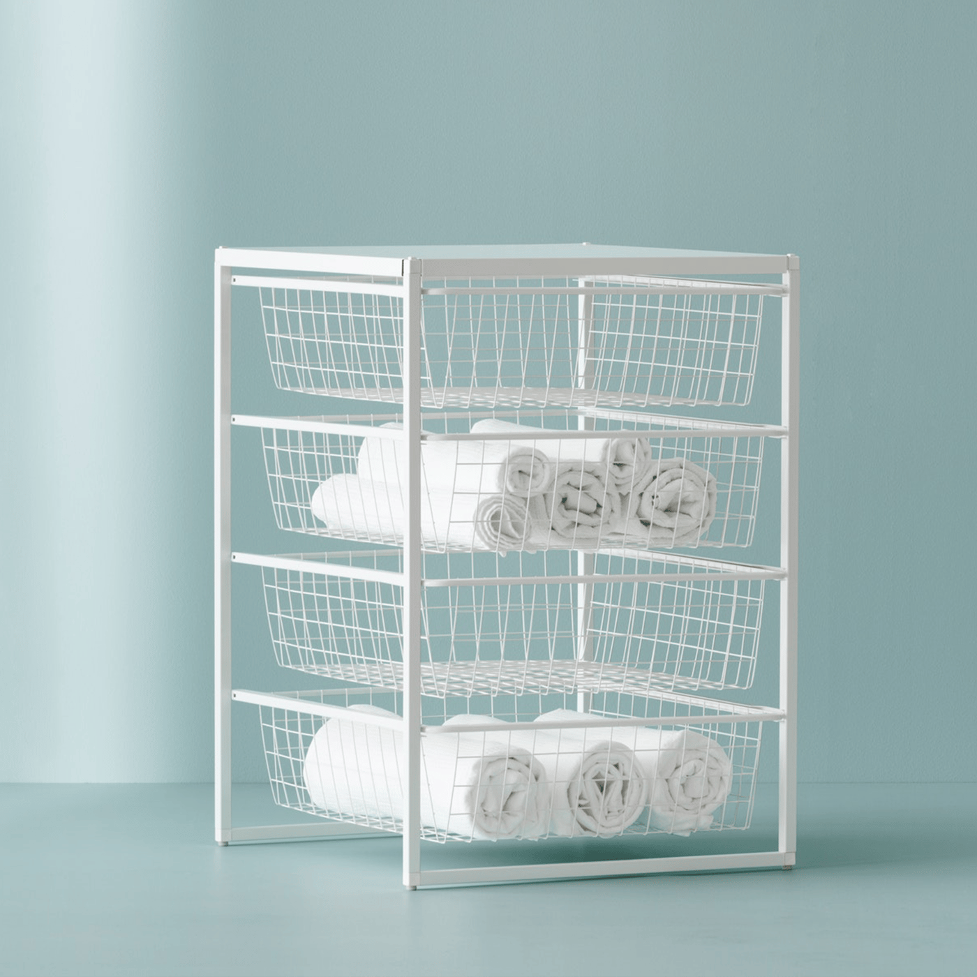  A frame with fine wire baskets on a light blue background.