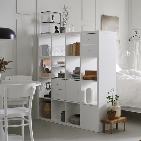A furnished KALLAX cabinet in a studio flat