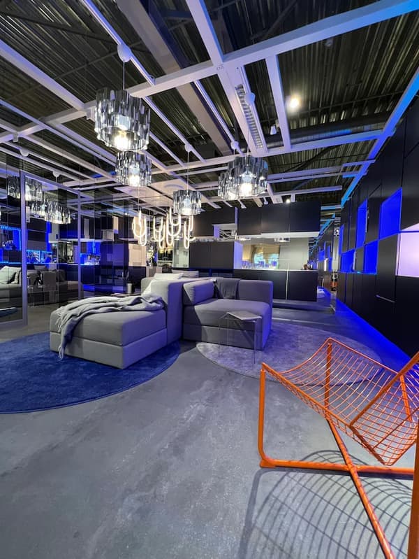 A futuristic interior with blue, grey and orange accents.