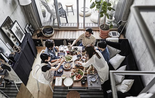 A gathering of friends around a dining room table.