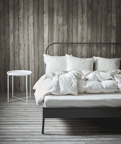 A GIF showing a bedroom transforming from almost empty to fully furnished.