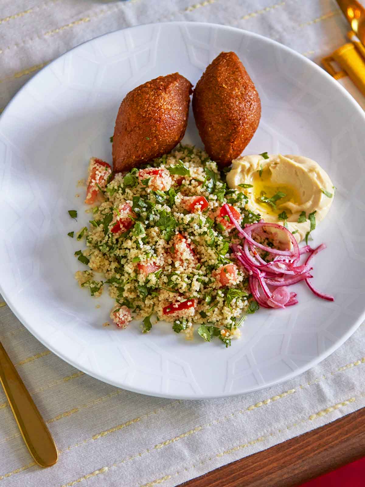 A GOKVÄLLÅ plate filled with festive food set on top of a GOKVÄLLÅ table runner.